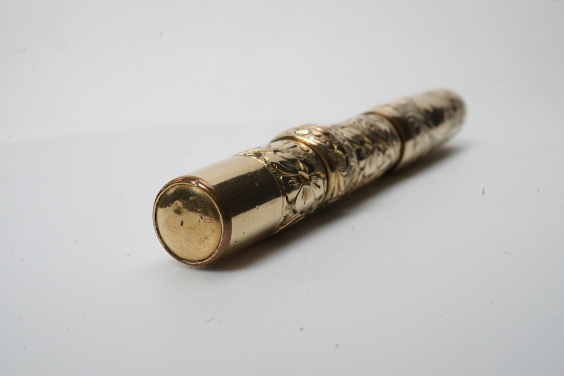 A Conklin ring top hand engraved crescent filler fountain pen with 14ct. gold Conklin nib